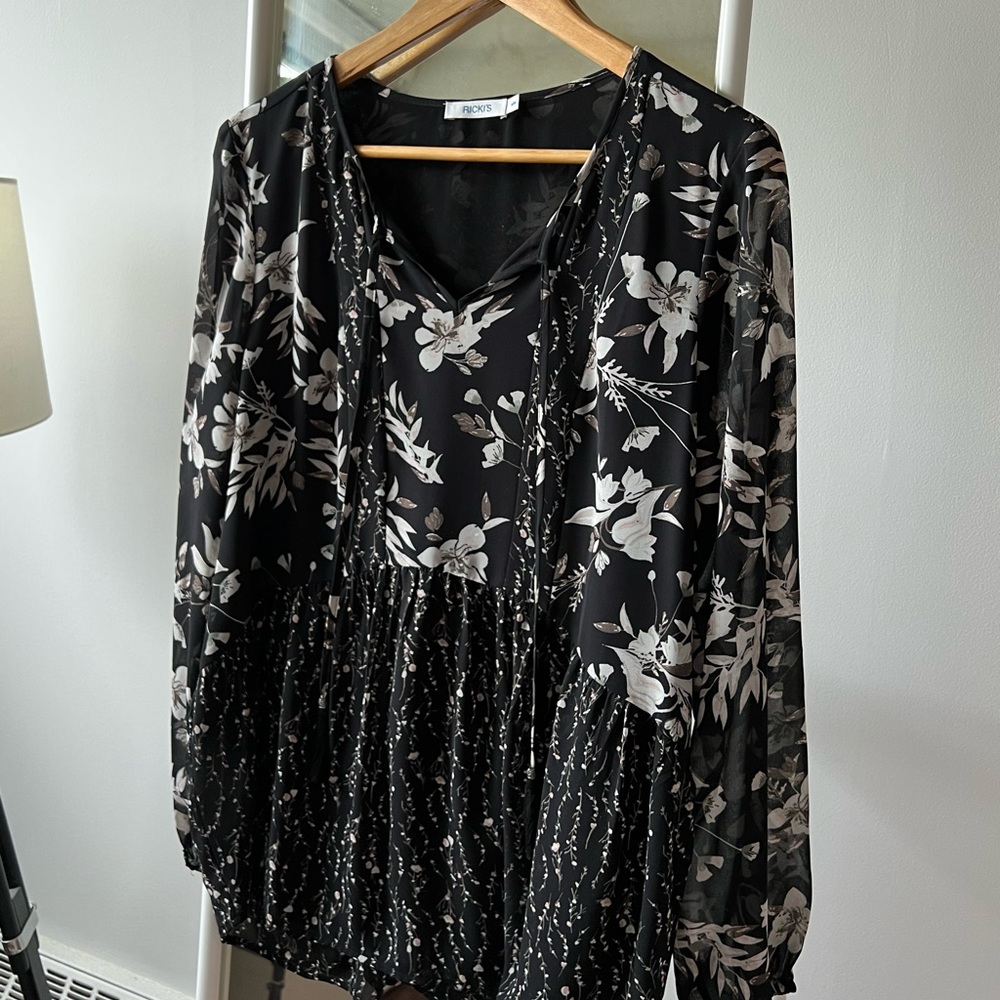 black floral peplum top with tassel ties.